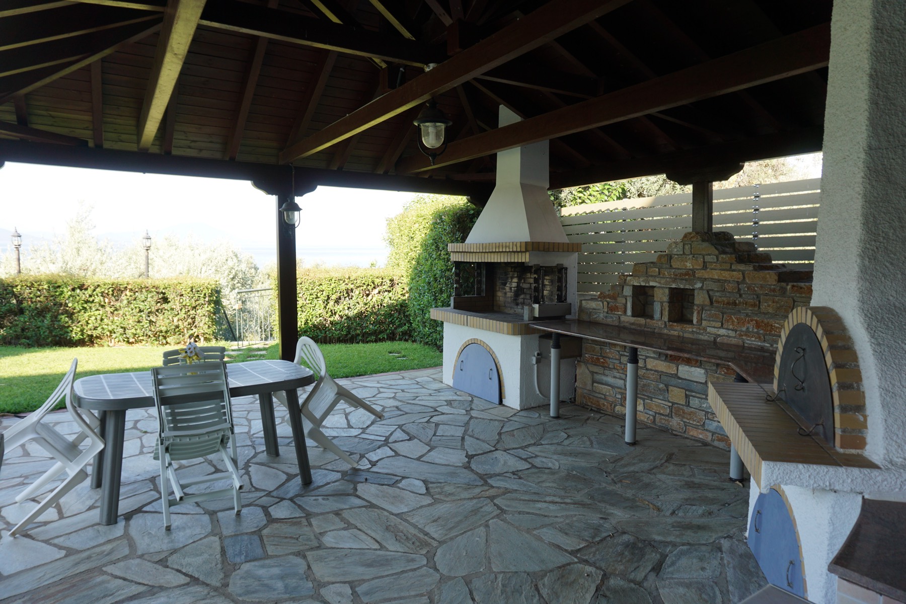 Outdoor kitchen with BBQ and wood oven